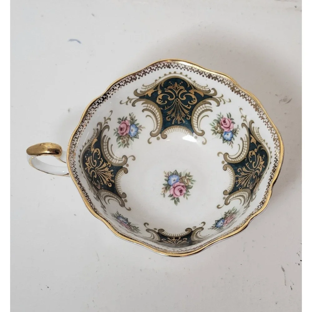 Paragon teacup - dark green panels on white background with floral‎ decor...Read